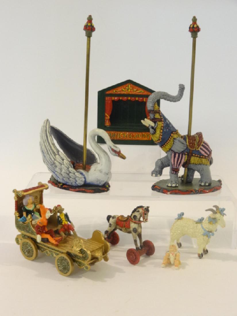 Dollhouse Artisan Toys & Rides Miniatures: Nice group of hand painted metal artisan circus rides and toys, Saxon Studios swan ride 6.5"H and elephant ride, Hantel circus wagon with jointed monkey, harlequin and princess 3.75"L excluding goat o