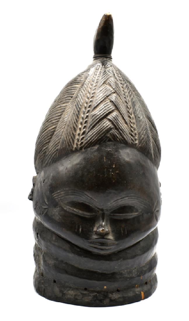 African Mende Carved Wood Helmet: Carved wood Mende helmet attributed to Sierra Leon, carved with elaborate hair, nice untouched patina, 17"H