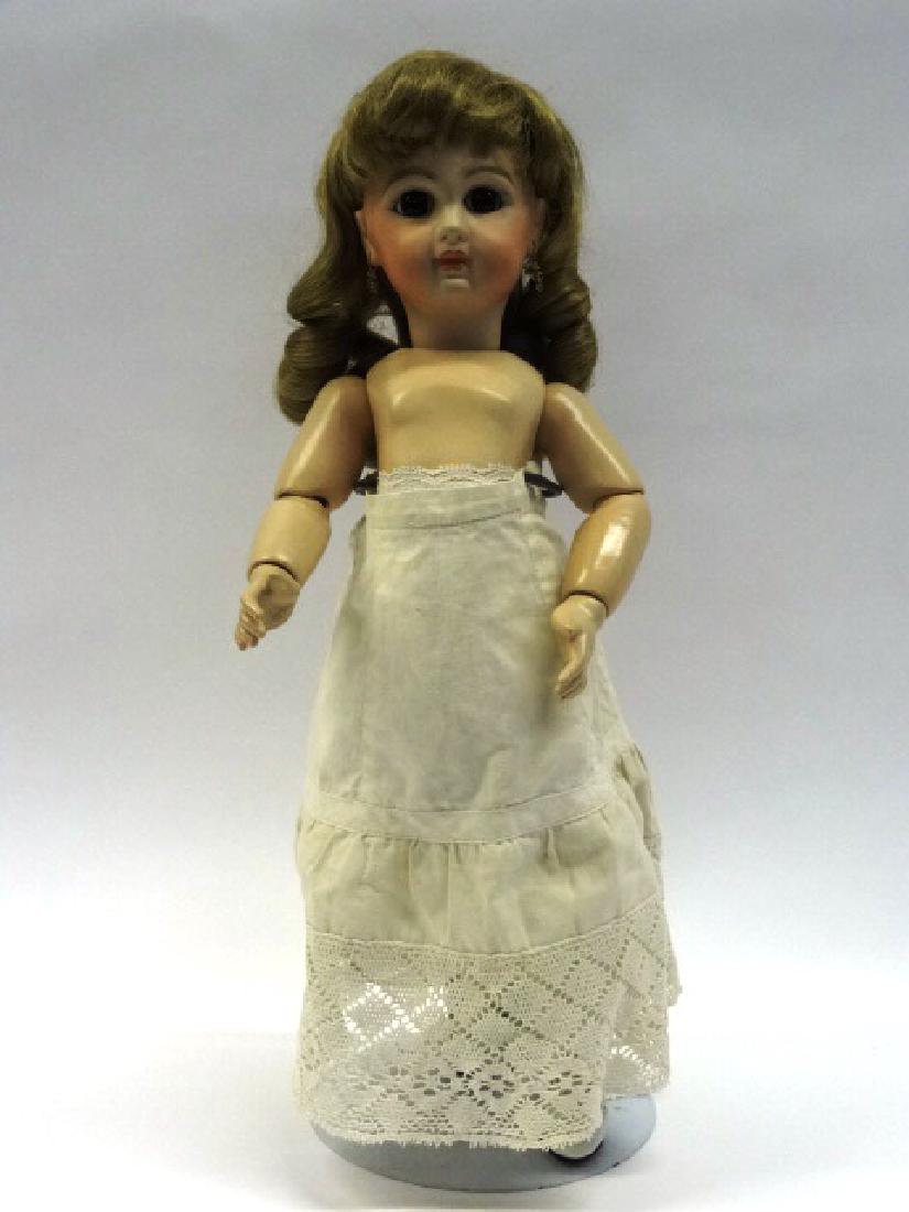 Reproduction Jumeau Doll: Jumeau reproduction with earrings, wig, glass eyes, jointed body, some underwear, stockings, & shoes 15 in. (t)