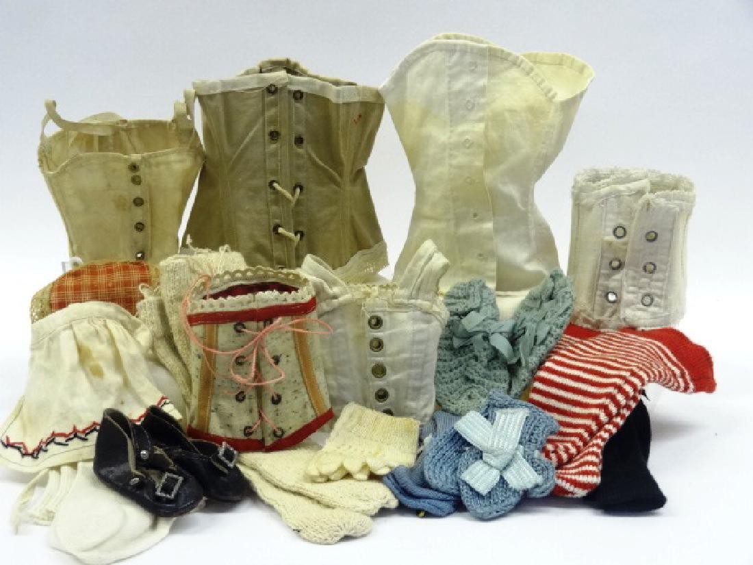 Collection of doll clothing: Corsettes, stockings, early doll shoes, gloves etc