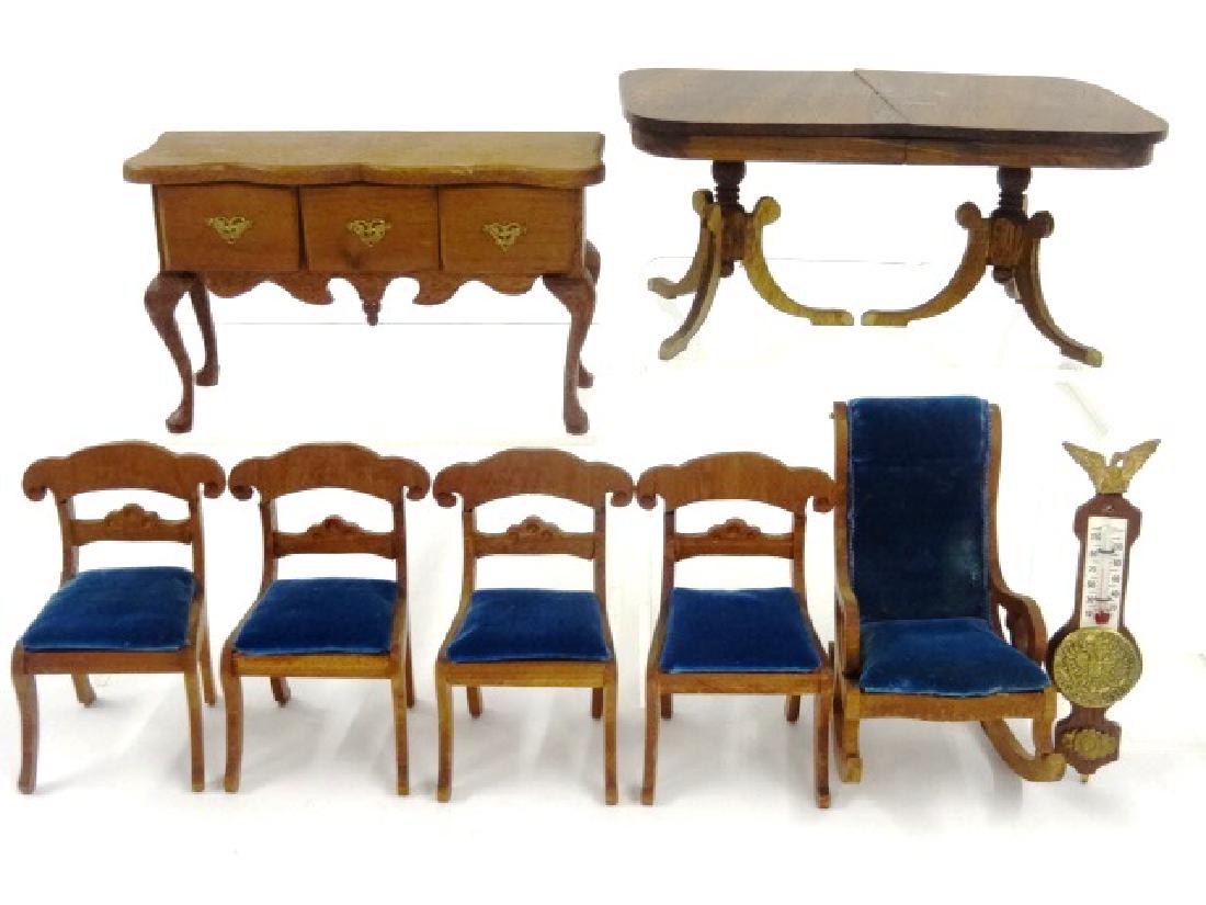 Vintage Mell Prescott Dollhouse Dining Room Furniture: Four signed mahogany fancy back saber leg chairs with blue velvet upholstery 3.25"H and a unsigned matching rocking chair 3.5"H, signed three drawer sideboard with scalloped top, ormolu pulls and cabr