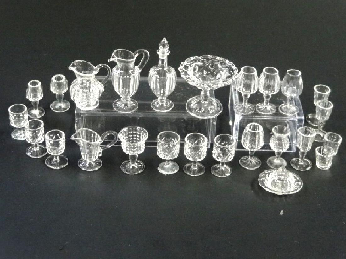 Ferenc Albert Dollhouse Glassware Miniatures: Ferenc Albert artisan dollhouse glassware, compote with lid 3/4"H, three styles of pitchers, bell, footed bowl, decanter with four matching wine glasses, set of four water glasses, set of five wine gl