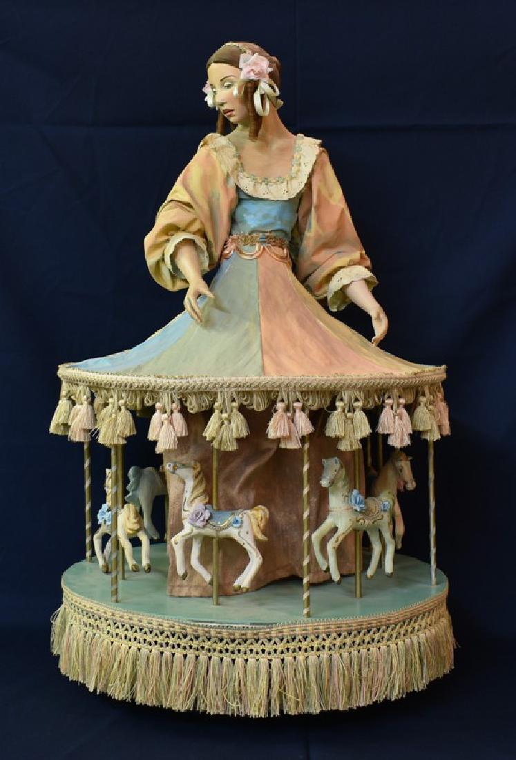 Vintage Doll Merry-Go-Round Electrified: Vintage electrified spinning carousel that was displayed for years in a Brooklyn New York bakery window, hand made paper Mache doll with dress billowing out to form top of carousel and backdrop behind