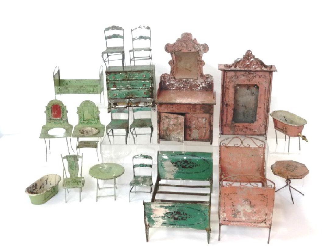 Antique German Painted Tin Dollhouse Furniture: Antique German stenciled tin wardrobe 8.75"H, dresser 4"W and bed 8"L with repaired leg, dresser with mirror 8.75"H with bed 6.25"L, child's bed 4.25"L with two wash stands and two tables, five matchi