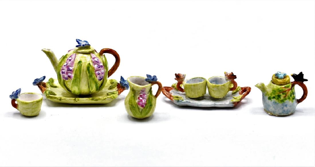 Veronique Cornish Figural Dollhouse Tea Wares: Veronique Cornish vegetable form teapot on tray 1.5"L, mug and pitcher all decorated with butterflies, teapot with bird on handle and eggs on lid 5/8"H, tray holding two cups with bird handles