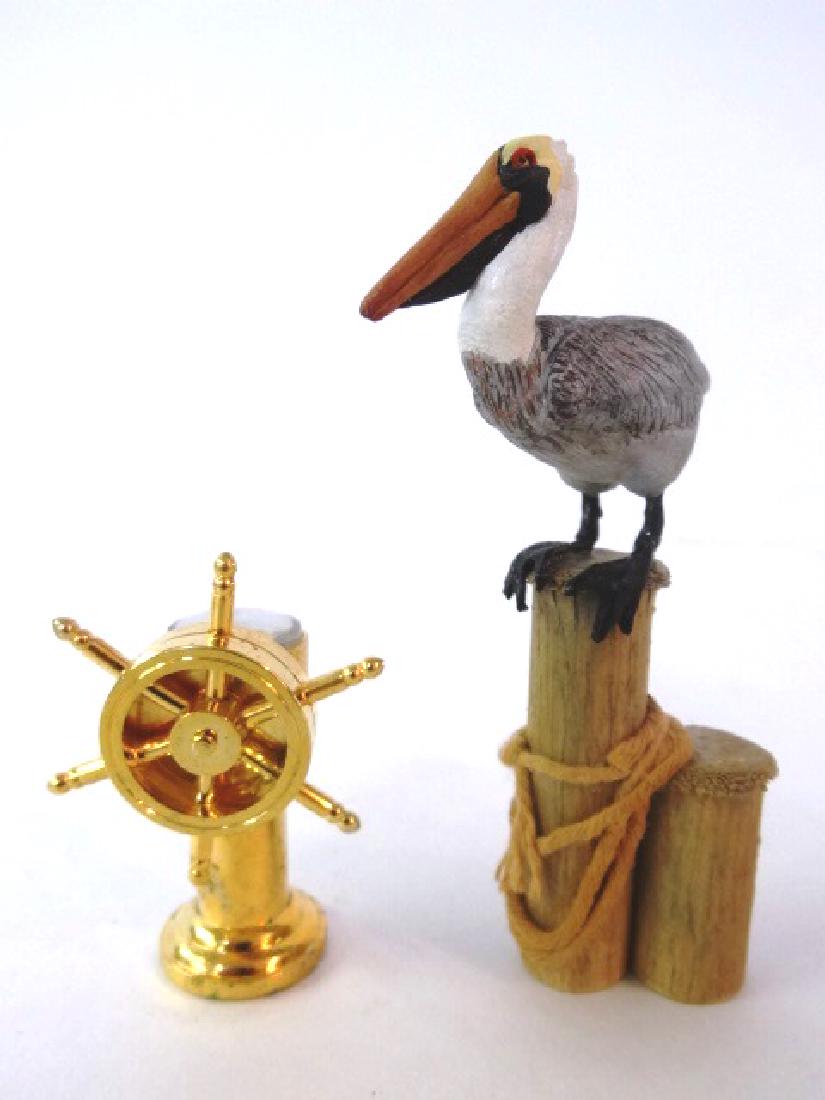 Jacki Transue Dollhouse Pelican Miniature & Others: Jacki Transue pelican mounted on wood piling 3.5"H, ship's steering control with compass 2"H