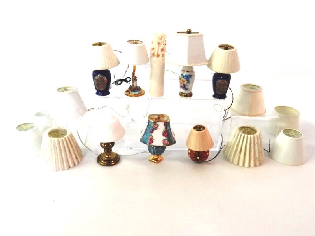 Dollhouse Miniature Table Lamps: Ginger Wyatt pair of blue table lamps decorated with roses 2"H, Niglo white lamp with flowers, brass lamp with lighthouse base, brass base with bisque shade signed illegibly, redware style small lamp,