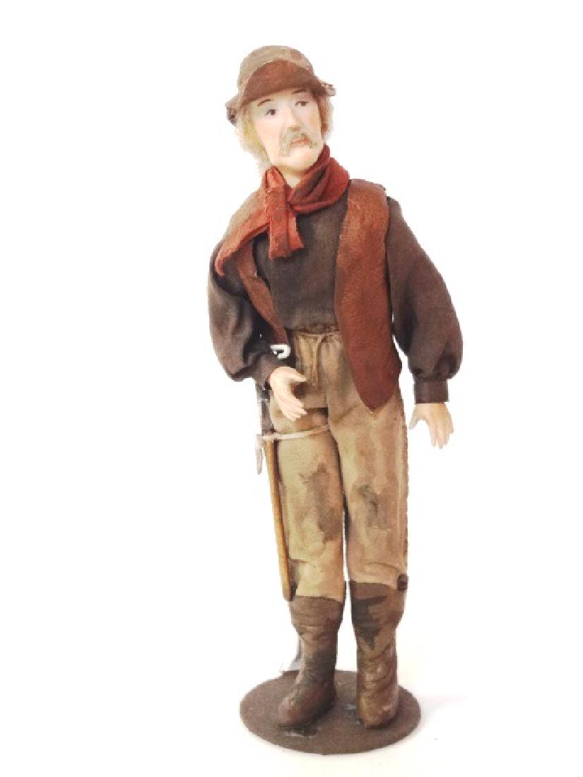 Dollhouse Lumberjack Character Doll Miniature: Nice quality unsigned bisque lumberjack doll wearing leather vest, breeches and boots, 6.5"H