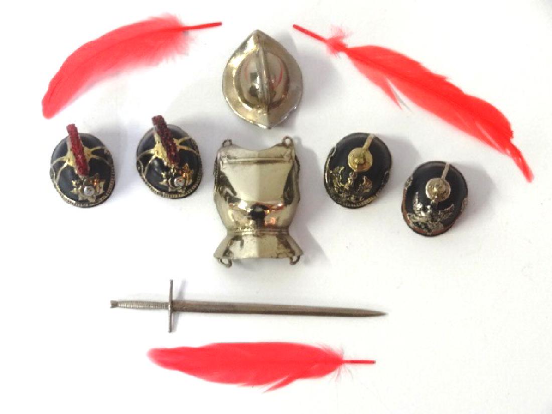 David Sciacca Dollhouse Helmets & Weaponry Miniatures: Five David Sciacca dollhouse artisan military helmets, two Saxony helmets, two Prussian infantry helmets, conquistador helmet and three plumes, breastplate and sword 3.25"L