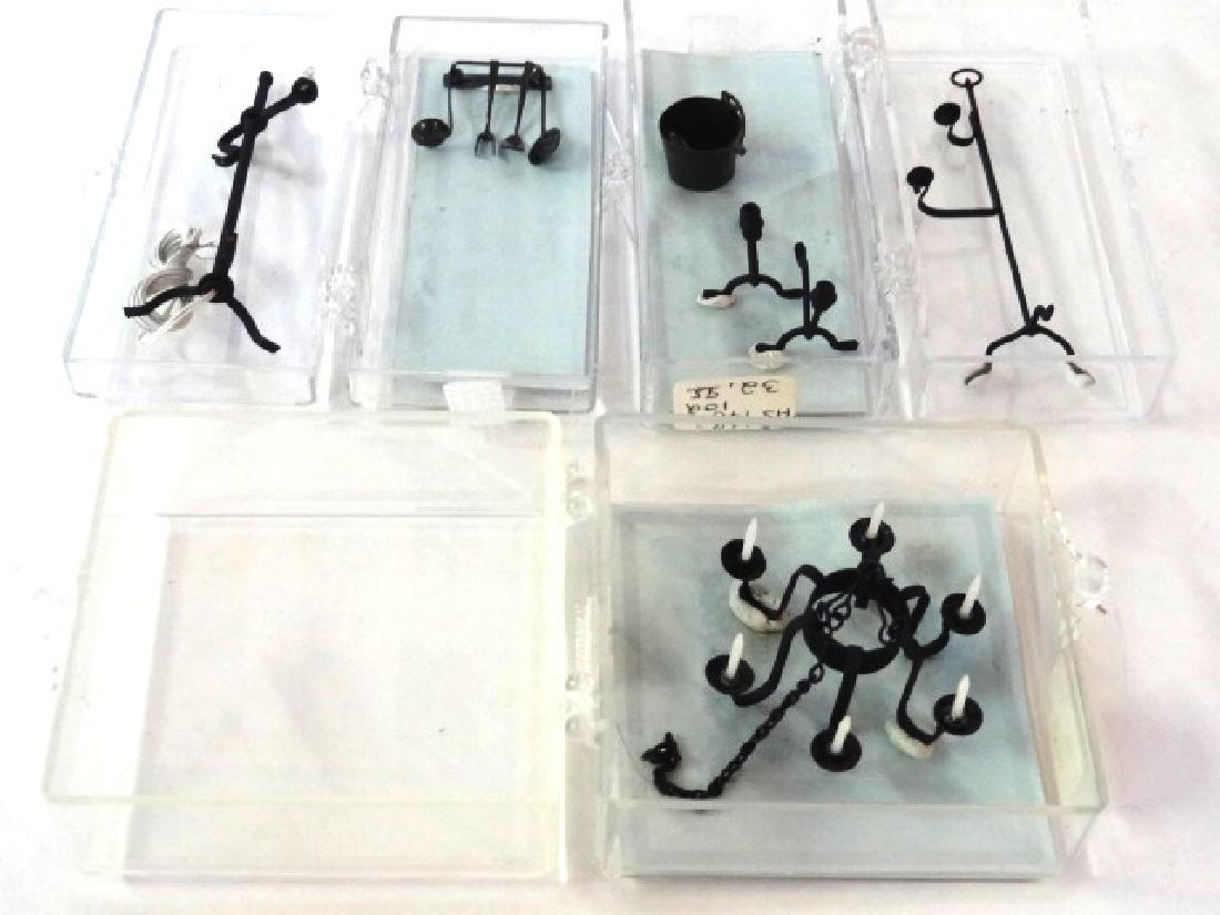 Mary Carson Artisan 1/2" Scale Metal Accessories: Nice group of hand made artisan metal accessories by Mary Carson in original boxes, six candle chandelier with chain 1.5"W, andirons, bucket, set of four cooking utensils with hanging rack, double soc