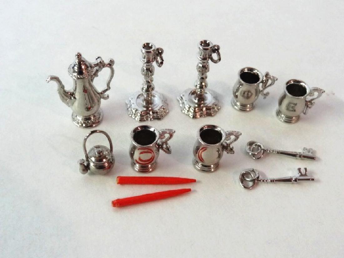 Colonial Williamsburg Sterling Dollhouse Miniatures: Grouping of Colonial Williamsburg silver with maker's mark IC, pair of candlesticks 1 1/16"H, four mugs, teapot, kettle and keys