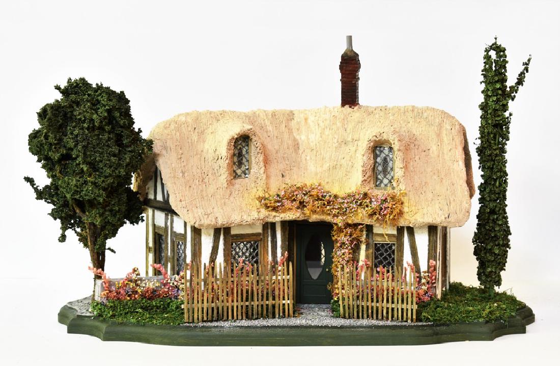 1/2" Scale Dollhouse English Cottage: Small 1/2" scale English style half timbered cottage with diamond pattern leaded windows, faux thatch style removable roof with four dormer windows and brick chimney, scalloped wood base beautifully d
