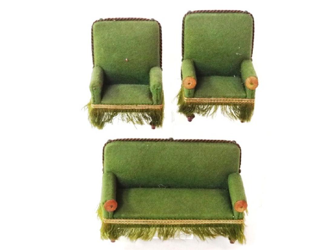 Antique German Dollhouse Sofas & Chairs Miniatures: Antique German dollhouse sofa with tack, braid and fringe decoration on turned Biedermeier style legs 5.5"W with two matching armchairs