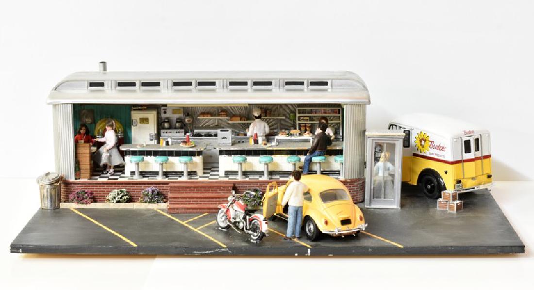 1/2" Scale 1950's Diner Diorama: Nicely detailed 1950's style 1/2" scale diner with open front showing a fully detailed kitchen with appliances and fixtures, cook and waitress behind counter, greaser eating breakfast, girl with poodl