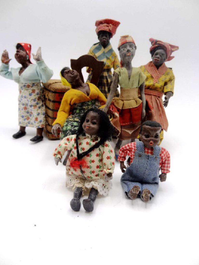 African American Dollhouse Character Dolls: Sleeping character doll signed Parker resting on a 1940 NY World's Fair bale of cotton 3.5"L, sitting doll with missing arm in antique wood chair 6"H, lady in floral skirt 5.25"H with dated 78 with il