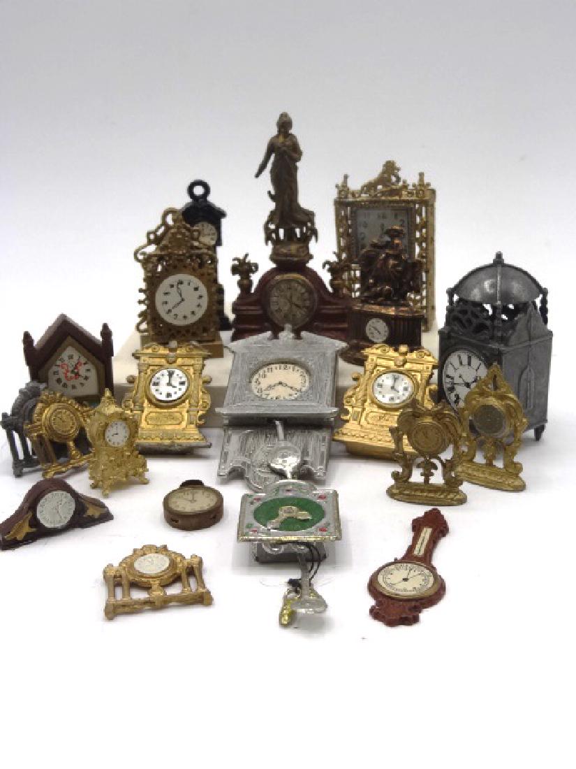Group of Dollhouse Metal Clock Miniatures: Nice selection of dollhouse miniature clocks, most are vintage and a few are new, English lantern clock 2.5"H, Mexican filigree clock with lion finial 2.5"H, wag on the wall, mantel, shelf, alarm, ste