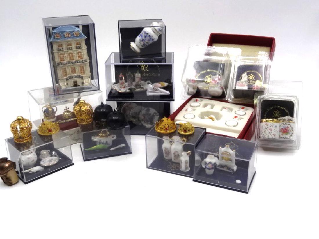 Reutter Porzellan Dollhouse Accessories & Others: Twelve display boxes with Reutter Porzellan accessories, Teddy Bear tea set, trash cans, miniature house, tea wares, vanity set, pitchers, clock vases, plates, barware, crock pot etc., boxed set of mi