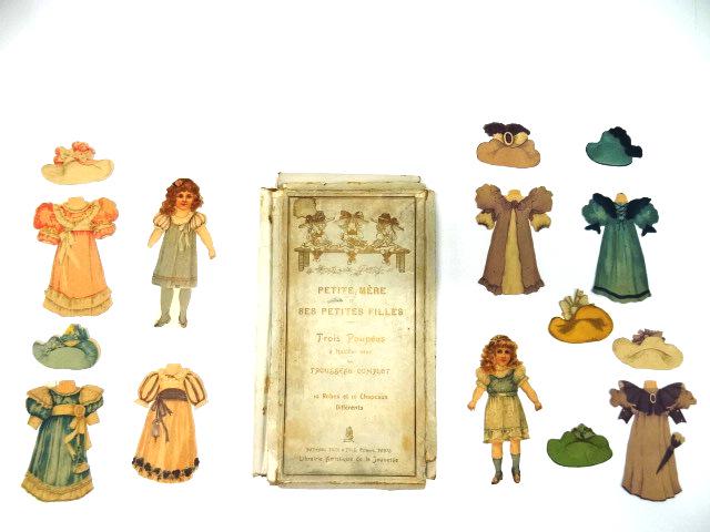 Tuck Boxed French Paper Dolls: Raphael Tuck Petite Mere box with broken flaps and small losses contains two of the original 6" dolls with replaced stands, six dresses and seven hats