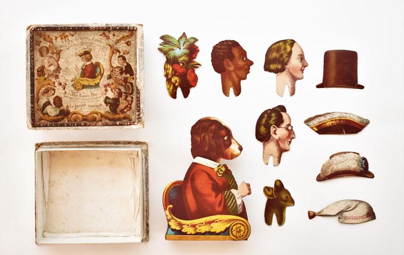 The Comic Boy Swinging Paper Doll Toy: Mid-19th century The Comic Boy by G.W.F. & W. swinging paper doll toy boxed set, two piece hand colored box printed in English, French and German with minor losses and one split flap corner 5.5" by 6"
