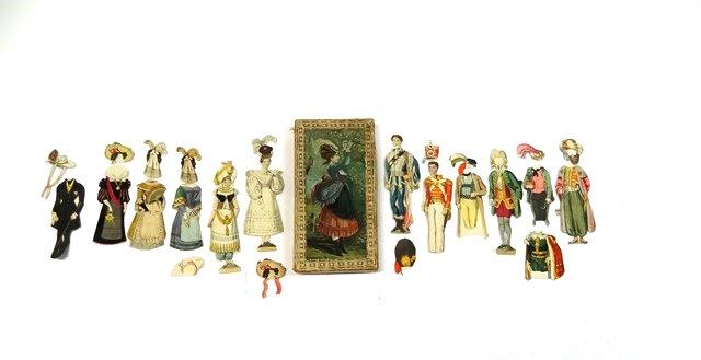 19th Century Paper Doll Set: Early paper doll set housed in a antique handkerchief box, 2 - 5" lady dolls with jointed mechanical arms, 6 dresses, 9 hat and hair pieces, 2 - 5.5" gentleman including one missing feet, 8 costumes, 