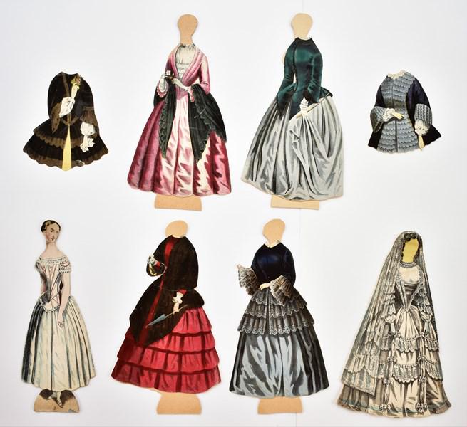 11" Ladies Of London Paper Doll Set: Circa 1850 large scale Ladies Of London paper doll set, 11" doll #2 with head and neck bends, base has minor bend and minor chipping at bottom edge, wedding gown, four dresses and two jackets