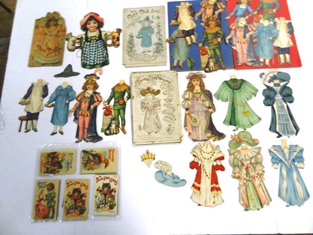 Early Raphael Tuck Paper Dolls: The Fairy Tale Series Of Dressing Doll has original folder with tears, 6" doll, 4 costumes and 5 hats, The Fairy Tale Series Of Dressing Dolls has folder with extensive tape repairs, 6" doll with tape