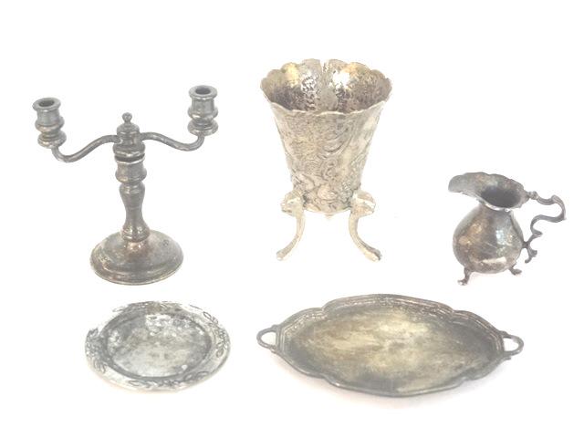 Silver Dollhouse Accessories: Dollhouse silver planter on lion head legs marked .800, heavy pitcher 1"H marked sterling, plate 1 1/8"D marked sterling, vintage two socket convertible candlestick with English silver hallmarks, unma