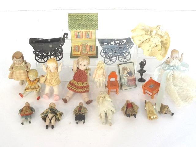 Antique Miniature Bisque Dolls & Others: Nice group of antique bisque jointed dolls from 1 1/8" to 2.5"H, vintage metal ballerina statue 1.5"H, small litho box top, pair of French baby carriages with one missing handle, small painted wood hi
