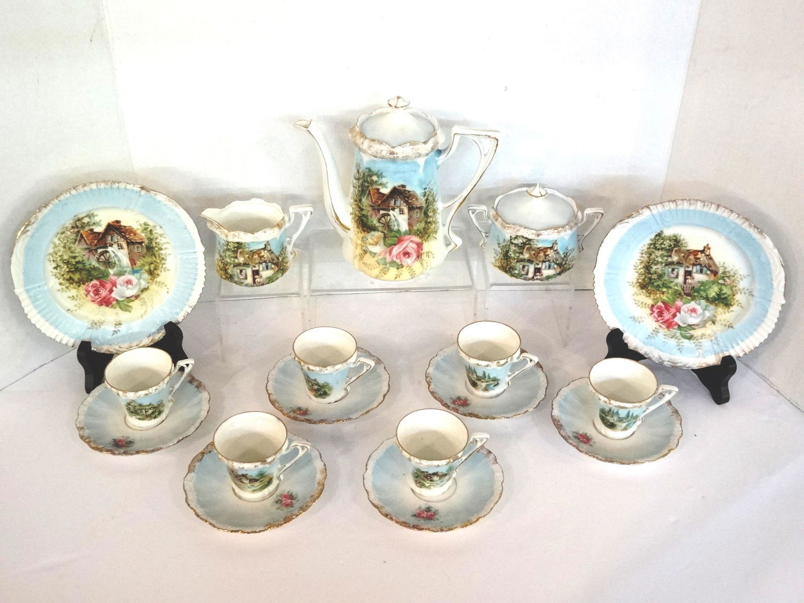 Antique Grist Mill Child Unmarked R.S. Prussia: Antique child's tea set attributed R. S. Prussia Grist Mill pattern, teapot 7"L, covered sugar bowl, creamer, 2 plates 6.25"D, 6 tea cups and 6 saucers with 1 small rim chip and a hairline, unsigned