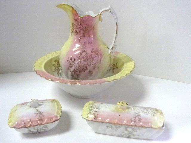 Antique Child's Chamber Set: Antique English china child sized chamber set, pitcher with rim repair 7"H, bowl 8.25"D, covered soap dish, covered brush or comb box with repaired finial