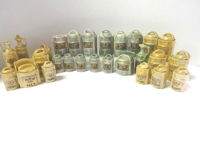 Two Vintage Child's Canister Sets: Canister set marked Germany has 6 piece canister set 3"H with 1 rim chip and 1 missing lid, 5 small canisters, salt box and oil bottle, Japanese set has 6 large canisters 3.25"H, 5 small canisters wit