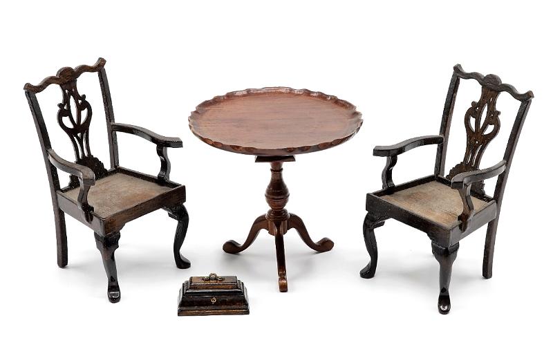 Virginia Merrill Tea Table & Chairs Dollhouse: Unsigned Table and chairs attributed to Virginia Merrill, pair of mahogany Chippendale style armchairs with intricately carved and pierced splats 3.25"H needing cushions, tilt top tea table with scall