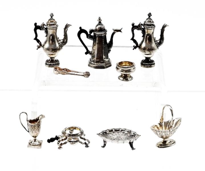 Obadiah Fisher Sterling Tea Wares Dollhouse Miniatures: Nice grouping of Obadiah Fisher sterling, lighthouse form teapot 1 1/16"H, two baluster form teapots, oval tea pot stand with scalloped rim, neo-classical creamer, sugar tongs with shell terminals, ov