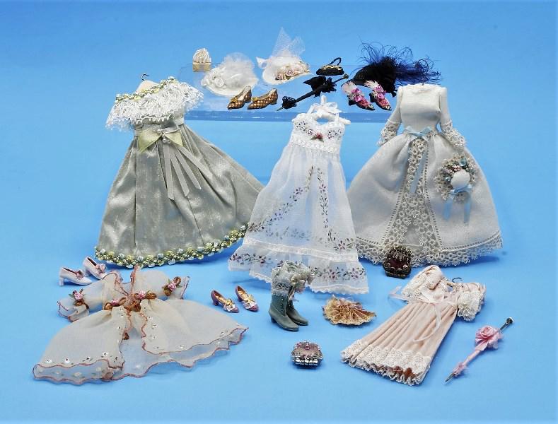 Dresses & Accessories Dollhouse Miniatures: Pat Stevens of Mini Mankins dress with matching bonnet on wire hanger 4.5"H, Mzia Dsamis nightgown dress on white hanger 4.5"H, two additional dresses and nightgown, three Nancy Manders hats, The Doll