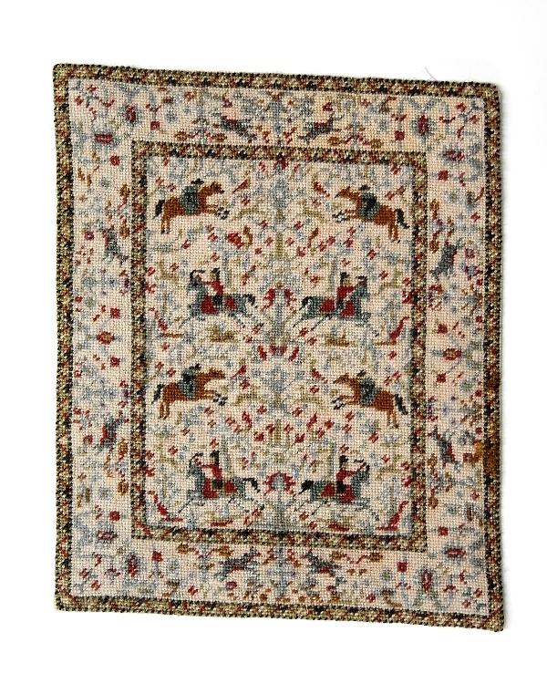 Jean duPont Artisan Equestrian Rug Dollhouse Miniature: Jean Austin duPont needlepoint rug depicting a rider on horseback running and jumping, signed JAD on reverse, 8 3/8" by 10.25"