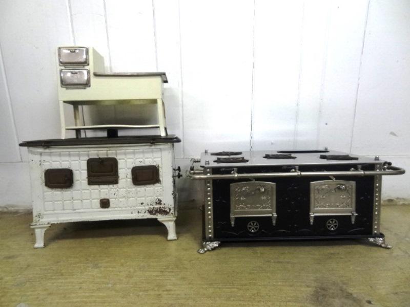 Two Marklin Stoves & other: Two Marklin Tin Stoves and others, largest 9 1/2", missing stove covers, two in good conditon and mrked, one white3 German stove is as is.