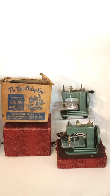 Two Child's Sewing Machines: Two child's sewing machines, Betsy Ross, 1 in original red case, 1 in OB, largest 9" x 8 3/4"