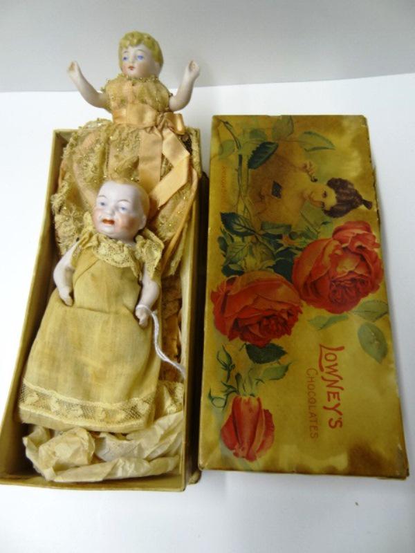 Two All Bisque Miniature Baby Dolls: Two all bisque baby dolls, one baby & one child, doll in vintage box, 4 1/2" all original clothing, both painted faces, closed mouths