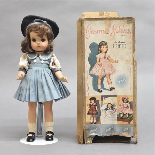 Madame Alexander Jeannie Walker Doll: Madame Alexander 14" composition doll in original box. Has original tagged sailor theme dress & black shoes, has unusual walking mechanism & magnetic hands. Marked on back Alexander Pat No 2171281