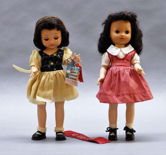 Two Ideal Betsy McCall Dolls: Two 14" hard plastic & vinyl Betsy McCall dolls, one in original dress & shoes w/hangtag & curlers, one in vintage dress & replaced shoes