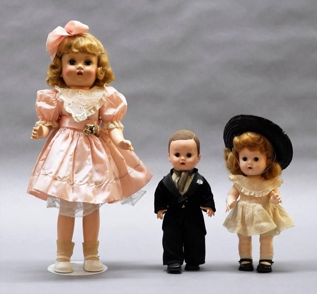 Horsman Doll and Two Small Dolls: Horsman 17" hard plastic doll in pink dress, two small 10" hard plastic dolls, girl is marked Nancy Ann on neck, no markings on boy doll