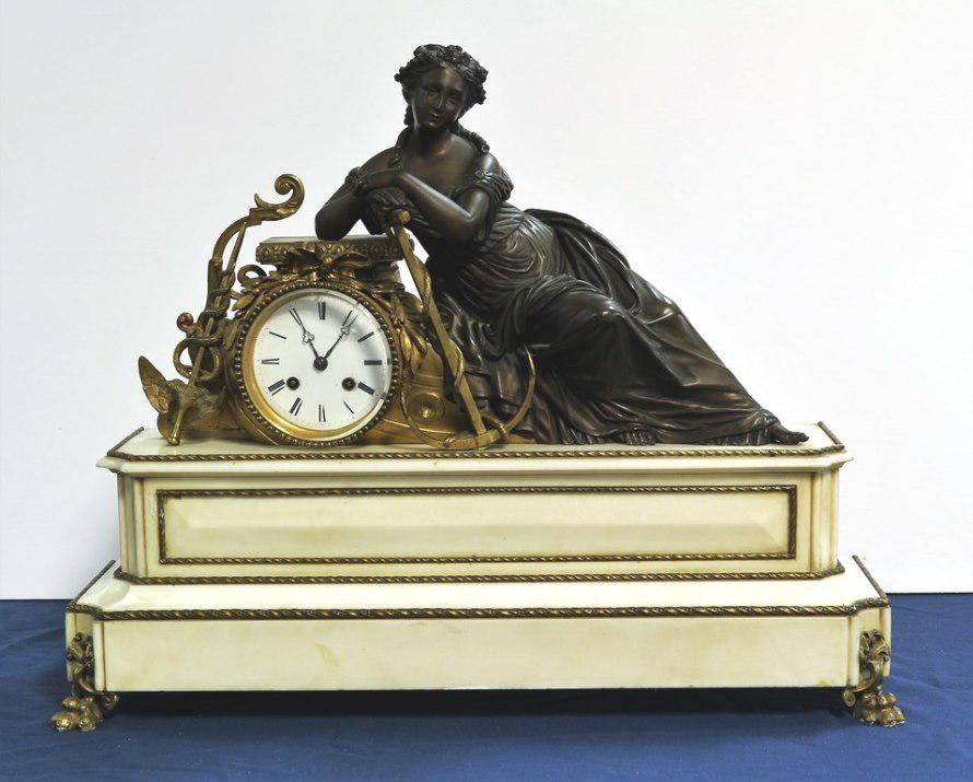 French Figural Mantle Clock: French Circa 1875 Two Tired Mantle Clock w/ Brass Mounts, with Bronze Reclining Lady, this is a two tier Marble Base clock