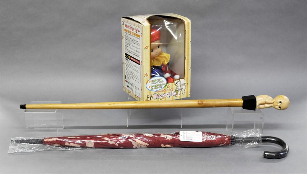 Japanese Market Kewpie Umbrella, Cane & Doll: Group of collectibles made exclusively for the Japanese market, umbrella in original bag, cane with wood shaft 34"L, plush doll in original box