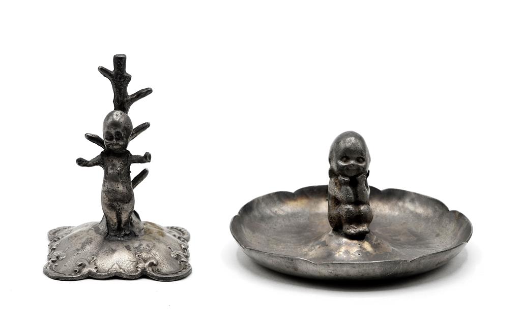Antique Kewpie Ring Tree & Dish: Antique cast metal Kewpie ring or thimble tree with illegible incised stamp on bottom 3.5"H, vintage pin dish with cast Kewpie signed "Kewpie" on its back 3.75"D