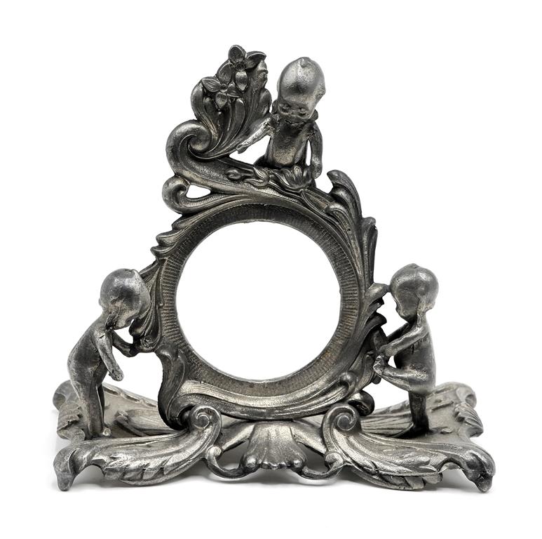 Antique Kewpie Pocket Watch Stand: Antique cast metal Kewpie pocket watch stand signed "O'Neill" on bottom 5.75"W