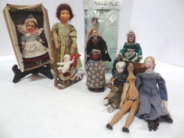 Vintage and Contemporary Small dolls: Two Artist Dollhouse Dolls, 6", China Heads one as is, German Bisque Head in original box bottom, new snow baby, Wooden Black Mammy Ramp Walker, Contemporary Wooden Dolls, and others. Largest 8" quite