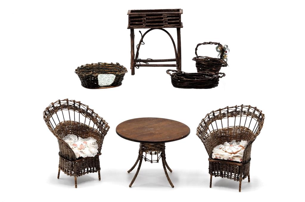 Warling Dollhouse Wicker Furniture & Others: Leilani & Roger Warling wicker chairs with lace trimmed cushions 3"W, 3.75"H, matching wood top table 3.5"D, 2.5"H, dog bed 2.5"W with two unsigned baskets and an unsigned plant stand 2.75"W
