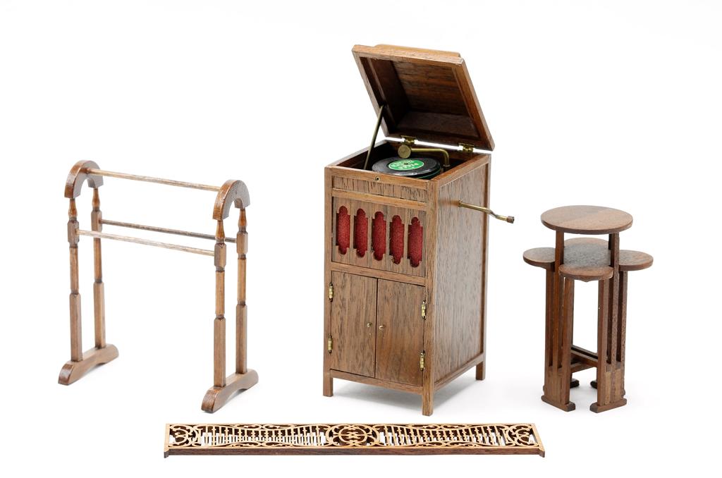 Long Dollhouse Victrola Cabinet & Others: Nicely detailed mahogany Victrola cabinet signed Long 3.75"H, arts and crafts style plant stand made from Imbuya wood signed Chattens Prescott Az. 2.75"H, unsigned quilt rack and a laser cut wood rail