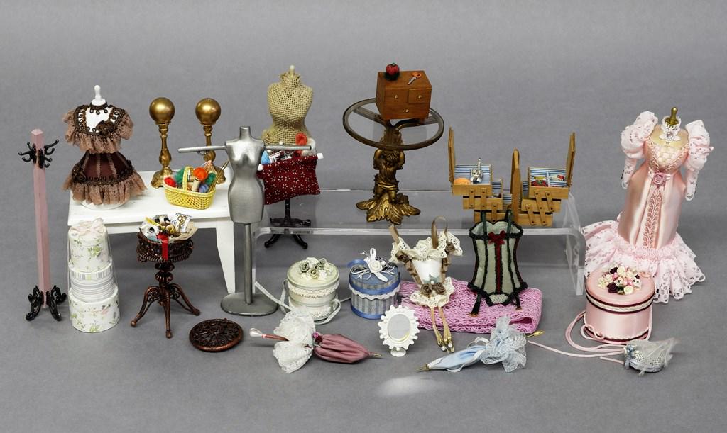 Dollhouse Dress, Lingerie, Sewing Boxes etc.: Dollhouse dress with beaded trim and lace on dress form 5"H, corsets, dress form, accordion sewing box with accessories 2"W, cast metal round sewing stand 2.5"H, small sewing box, basket and bag, cast