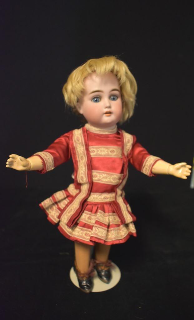 Bisque Doll S & H K * R Mechanical Roller Skating doll: SD & H K * R Mechanical Roller Skating doll 11 1/2" old clothing , nice com[position body, roller skates on bottom of foot, mechanical , runs with clock key, we do not have the original key. Hair seem